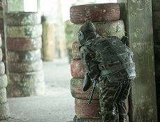Soldier in gear standing near building