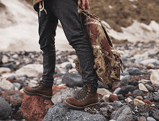 Person walking in mud in tactical boots